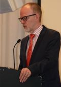 Geert Dancet delivering a keynote presentation 