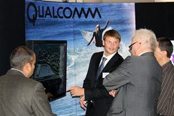 Delegates visiting Qualcomm's demonstration/exhibition stand