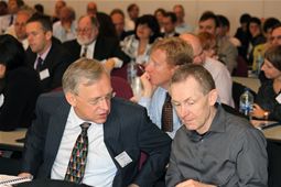 Delegates discussing the day's proceedings