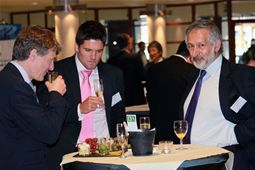 Delegates networking and enjoying drinks!